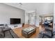 Bright living room features hardwood floors and views into dining area at 1926 Dresden Ct, Henderson, NV 89014