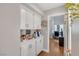 White kitchen pantry with open shelving and storage at 1926 Dresden Ct, Henderson, NV 89014