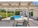 Relaxing pool area with pergola, patio furniture, and grill at 1926 Dresden Ct, Henderson, NV 89014