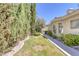 Landscaped side yard with a paved walkway leading to the backyard at 1926 Dresden Ct, Henderson, NV 89014