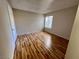 Well-lit bedroom featuring hardwood floors and a closet at 1963 Scimitar Dr # 0, Henderson, NV 89014