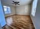 Spacious bedroom with wood-look floors and large windows at 1963 Scimitar Dr # 0, Henderson, NV 89014