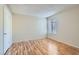 Empty bedroom featuring laminate flooring and a window with blinds at 1963 Scimitar Dr # 0, Henderson, NV 89014