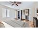 Serene bedroom featuring hardwood floors, a ceiling fan, and closet organizers at 1963 Scimitar Dr # 0, Henderson, NV 89014