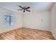 Empty bedroom with laminate flooring, a ceiling fan and a window with blinds at 1963 Scimitar Dr # 0, Henderson, NV 89014