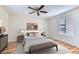 Stylishly staged bedroom featuring a ceiling fan and an area rug over hardwood floors at 1963 Scimitar Dr # 0, Henderson, NV 89014