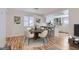 Bright dining area featuring a modern dining table and chairs near a kitchen with an island at 1963 Scimitar Dr # 0, Henderson, NV 89014