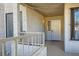 The entryway to the unit includes a secure door, a window with blinds, and a small porch at 1963 Scimitar Dr # 0, Henderson, NV 89014