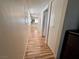 Long hallway with wood-look floors and access to rooms at 1963 Scimitar Dr # 0, Henderson, NV 89014