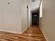 Long hallway with hardwood floors and access to bedrooms at 1963 Scimitar Dr # 0, Henderson, NV 89014