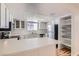 Bright kitchen featuring white cabinetry, stainless steel appliances, and plenty of counter space at 1963 Scimitar Dr # 0, Henderson, NV 89014