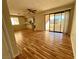 Spacious living room with hardwood floors and access to a balcony at 1963 Scimitar Dr # 0, Henderson, NV 89014