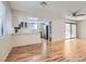 Open layout of the living room and kitchen area with hardwood flooring and a sliding glass door at 1963 Scimitar Dr # 0, Henderson, NV 89014