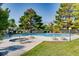 Outdoor pool with lounge chairs and mature trees providing a relaxing atmosphere at 1963 Scimitar Dr # 0, Henderson, NV 89014