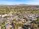 Aerial view of neighborhood near golf course with mountain views at 2192 Geronimo Way, Las Vegas, NV 89169