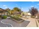 Landscaped backyard with garden and greenhouse at 2192 Geronimo Way, Las Vegas, NV 89169