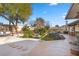 Landscaped backyard with stone pathways and seating at 2192 Geronimo Way, Las Vegas, NV 89169