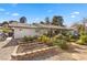 Backyard with raised garden beds and stone path at 2192 Geronimo Way, Las Vegas, NV 89169