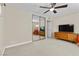 Spacious bedroom with mirrored closet doors and TV at 2192 Geronimo Way, Las Vegas, NV 89169