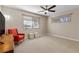 Bright bedroom with ceiling fan and comfortable seating area at 2192 Geronimo Way, Las Vegas, NV 89169