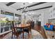 Bright dining room with hardwood floors and open kitchen view at 2192 Geronimo Way, Las Vegas, NV 89169