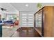 Bright and airy entryway with hardwood floors and a mid-century cabinet at 2192 Geronimo Way, Las Vegas, NV 89169