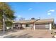 Updated single story home with modern garage door and landscaping at 2192 Geronimo Way, Las Vegas, NV 89169