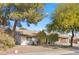 Ranch style home with established trees and a well-manicured yard at 2192 Geronimo Way, Las Vegas, NV 89169