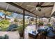 Relaxing covered patio with seating and ceiling fans at 2192 Geronimo Way, Las Vegas, NV 89169