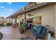 Outdoor patio with comfortable seating and artwork at 2192 Geronimo Way, Las Vegas, NV 89169