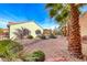 Landscaped backyard with gravel and desert plants at 2373 Rosendale Village Ave, Henderson, NV 89052