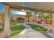 Landscaped backyard with pergola and patio at 2373 Rosendale Village Ave, Henderson, NV 89052