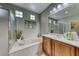 Bathroom with a large soaking tub and vanity at 2373 Rosendale Village Ave, Henderson, NV 89052