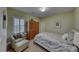 Guest bedroom with a queen bed and sitting area at 2373 Rosendale Village Ave, Henderson, NV 89052