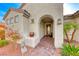 Elegant entryway with arched doorway and terracotta pot at 2373 Rosendale Village Ave, Henderson, NV 89052