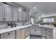 Modern kitchen with gray cabinets, marble countertops, and stainless steel appliances at 2373 Rosendale Village Ave, Henderson, NV 89052