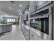 Kitchen with gray cabinets, marble countertops, and stainless steel appliances at 2373 Rosendale Village Ave, Henderson, NV 89052