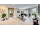 Bright and airy living area with a grand piano as a focal point at 2373 Rosendale Village Ave, Henderson, NV 89052