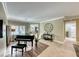 Spacious living room with hardwood floors and a grand piano at 2373 Rosendale Village Ave, Henderson, NV 89052