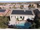 Aerial view of home with solar panels, pool, and desert landscaping at 2423 Blair Castle St, Henderson, NV 89044