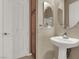 Bathroom featuring pedestal sink and wood cabinet at 2423 Blair Castle St, Henderson, NV 89044