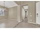 Formal dining area with tiled floors and a chandelier at 2423 Blair Castle St, Henderson, NV 89044