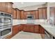 Kitchen features stainless steel appliances and wood cabinets at 2423 Blair Castle St, Henderson, NV 89044