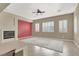 Living room with fireplace, neutral walls, and large windows at 2423 Blair Castle St, Henderson, NV 89044