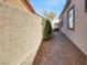 Landscaped side yard with brick pathway at 2423 Blair Castle St, Henderson, NV 89044