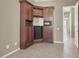 Built-in wet bar with cabinets and a mini-refrigerator at 2423 Blair Castle St, Henderson, NV 89044