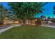 Expansive grassy backyard with a large tree, providing shade and privacy at 2505 Laurie Dr, Las Vegas, NV 89102