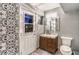 Updated bathroom with modern vanity, patterned tile, and a spacious shower at 2505 Laurie Dr, Las Vegas, NV 89102