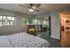 Bedroom with king-size bed, recliner, and mirrored closet at 2505 Laurie Dr, Las Vegas, NV 89102