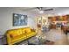 Open living area features a mustard yellow couch and kitchen views at 2505 Laurie Dr, Las Vegas, NV 89102